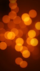 Festive bokeh lights in warm tones with a glowing effect. Ideal for holiday celebrations, festive backgrounds, or romantic settings