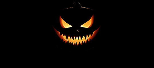 Fototapeta premium Glowing Jack-o'-Lantern with Fangs