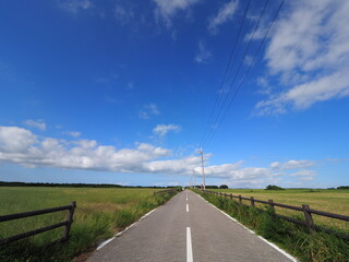 a road under the blue sky