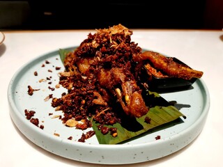 A crispy and flavorful Indonesian dish, known as Ayam goreng