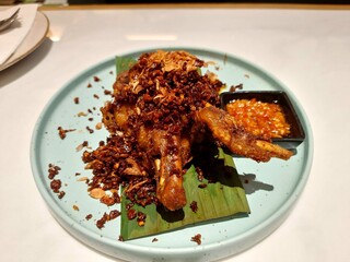 A crispy and flavorful Indonesian dish, known as Ayam goreng