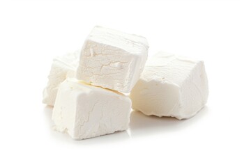 A stack of colorful marshmallows on a clean white surface