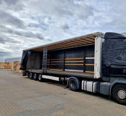 customs control of a van or truck. the car's tarpaulins are raised and suspicious cargo boxes are...