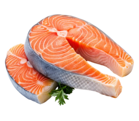 Two fresh salmon steaks lying on top of each other with parsley