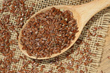 topview of flaxseeds in a wooden spoon	
