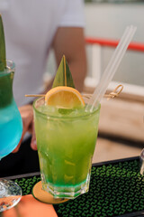 Refreshing Tropical Cocktail Garnished with Citrus and Green Leaf