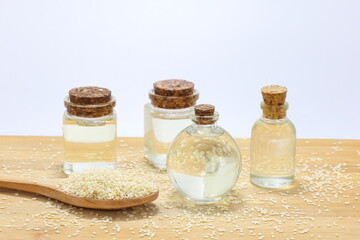 sesame oil in bottles and sesame seeds