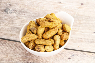 Raw ripe unpeeled peanut heap