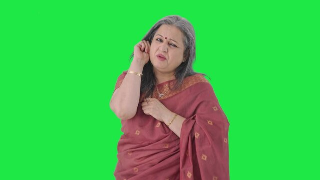 Guilty Indian old woman apologizing and saying sorry Green screen