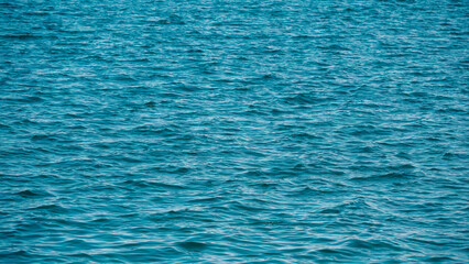 pattern of blue sea water with small waves