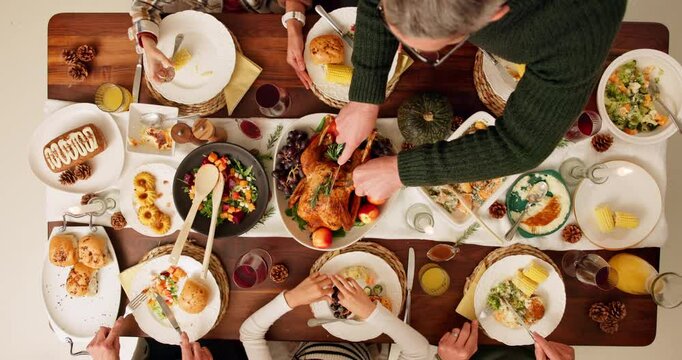 Dining table, food and family at thanksgiving dinner with gourmet chicken, vegetables and juice. Meal, buffet and people at festive event or party celebration for dinner, lunch or home from above.