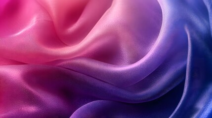Fototapeta premium Close-up of pink, purple and blue ombre silk fabric with soft, flowing folds.