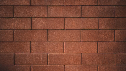 Red concrete block wall. Brick blocks pattern background. Building construction material.