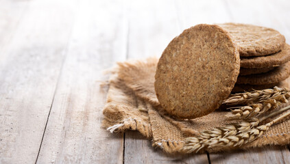 Healthy oatmeal cookies on wooden table. Copy space