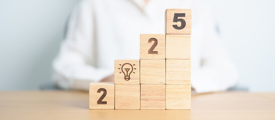 2025 year block with lightbulb. Business Idea, Creative, Thinking, brainstorm, Goal, Resolution,...