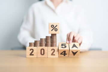 2024 to 2025 New year with percentage change to UP and Down arrow with coin stack. Interest rate, GDP, stocks market, financial, deflation and Inflation, mortgage, debt, Loan and Economic Recession