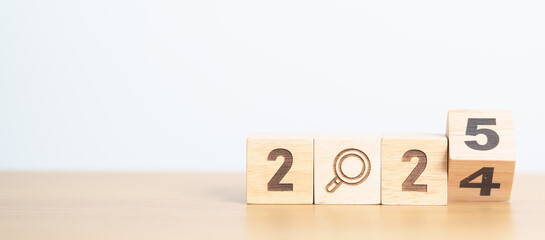 2024 year change to 2025 year block with magnifying glass icon. SEO, Search Engine Optimization,...