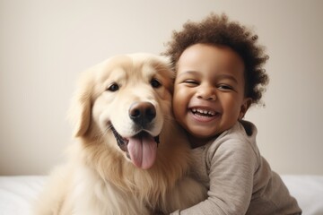 Toddler hugging Golden Retriever