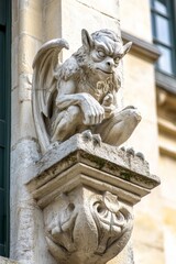 An ornate gothic gargoyle with winged details on the facade of a stunning ancient architecture