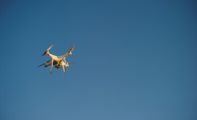 Drones take aerial photos of tourists and professional photographers. Flying photography equipment.