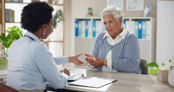 Arthritis, doctor and senior woman with hand pain, diagnosis or joint problem with inflammation. Pensioner, old person or mature lady with caregiver, specialist and talk for medicare or treatment