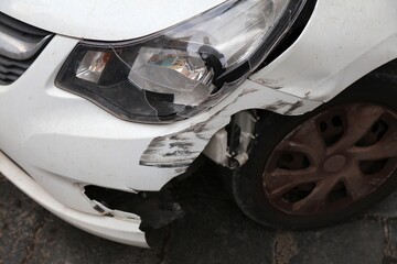 Damaged plastic car bumper in Italy