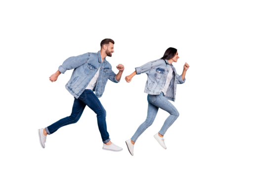 Full length body size photo of funny enjoying nice good cute couple wearing jeans denim clothes having contests at fast running while isolated with blue background