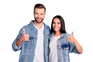 Portrait of charming spouses showing thumb up wearing denim jeans isolated over blue background