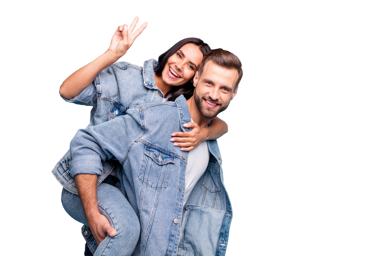 Portrait of lovely guy carrying his passion making v-signs wearing denim jeans jacket isolated over blue background