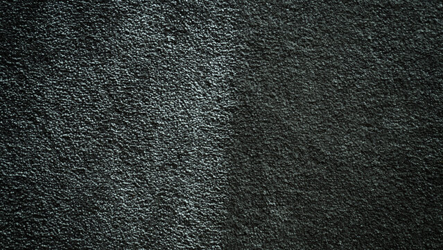 black and dark  gray texture backgroung devided into two dark and light parts