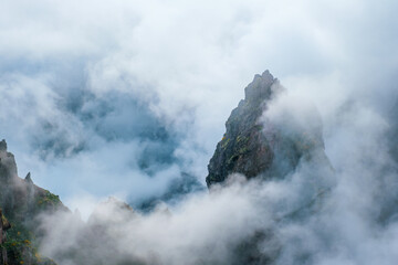 A mountain covered in fog and clouds. Near Pico de Arieiro , Madeira island, Portugal
