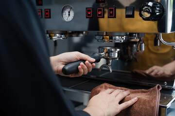 Barista Preparing Espresso with Professional Coffee Machine in Modern Cafe Setting