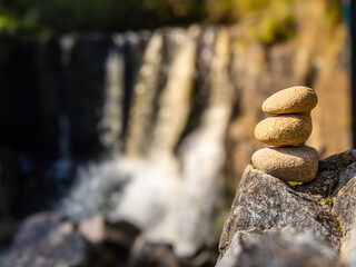 Balanced stones in front of Tullydermot Falls in County Cavan