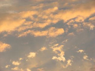 Obraz premium Cloudscape, Colored Clouds at Sunset near the Ocean in a Tropical Climate