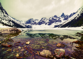 Frozen Lake Morskie Oko or Sea Eye Lake in Poland at Winter. © Roxana