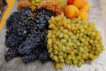 Fresh grapes and peaches at a farmer's market