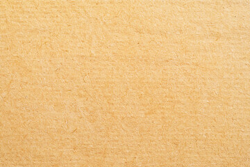 Fototapeta premium Creative background of light brown rough paper texture background design.