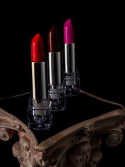 Beautiful lipsticks on black background