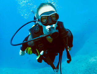 Diver Engaging in the Fascinating Exploration of Vibrant Ocean Life