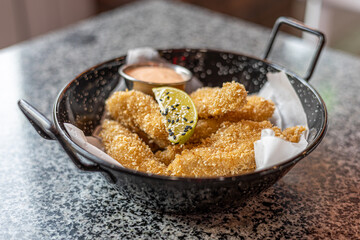 golden deep-fried battered chicken nuggets.succulent chicken chunks ensconced in a delectable...