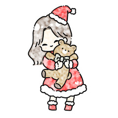 くまのぬいぐるみを抱きしめる女の子