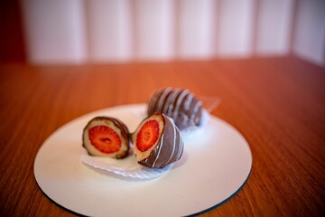Chocolate-covered strawberries on a wooden table
