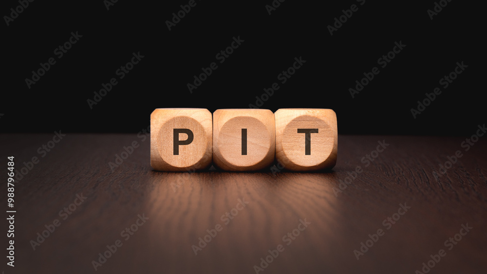 Poster wooden blocks arranged to spell the word pit on a table surface displaying craftsmanship