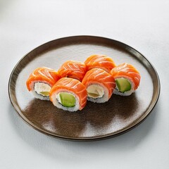 Salmon and avocado sushi rolls on white background