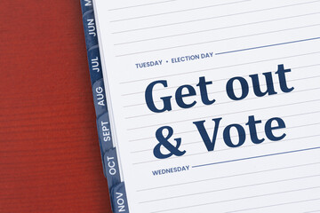 Obraz premium Get out and vote message on a Tuesday day planner on desk
