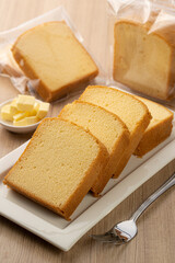 Freshly Sliced Butter Cake on a Wooden Table