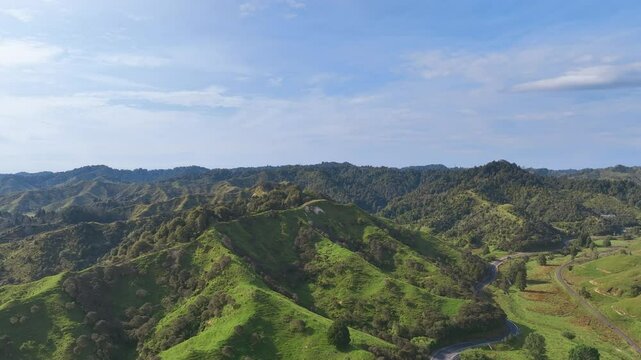 Flight across the wild landscapes, highway, and tourism railway of New Zealand's popular Forgotten World Highway, deep in the back country of the North Island's Taranaki province.