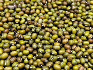 Close-up of heap of nutritious green mung beans, an ingredient in many vegan recipes