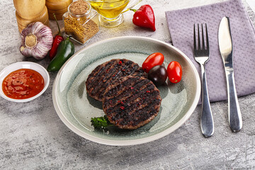 Grilled burger cutlet with sauce