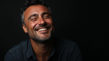 Fototapeta premium Portrait of a happy handsome man in a shirt with laughing